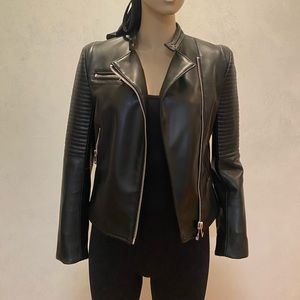 Faux leather this is a pleather jacket.